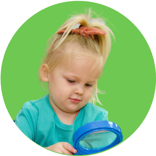 Child exploring with magnifying glass