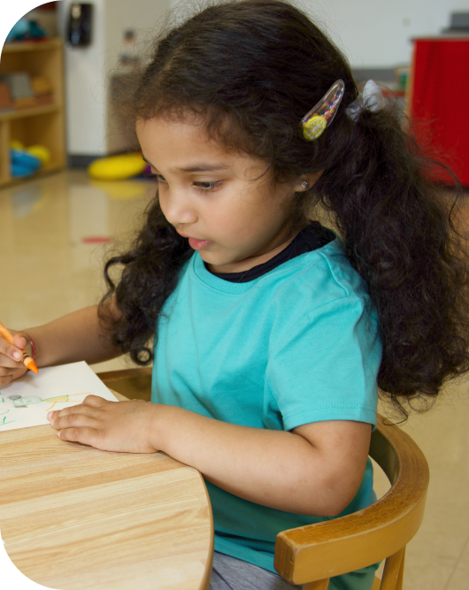 Child writing at desk